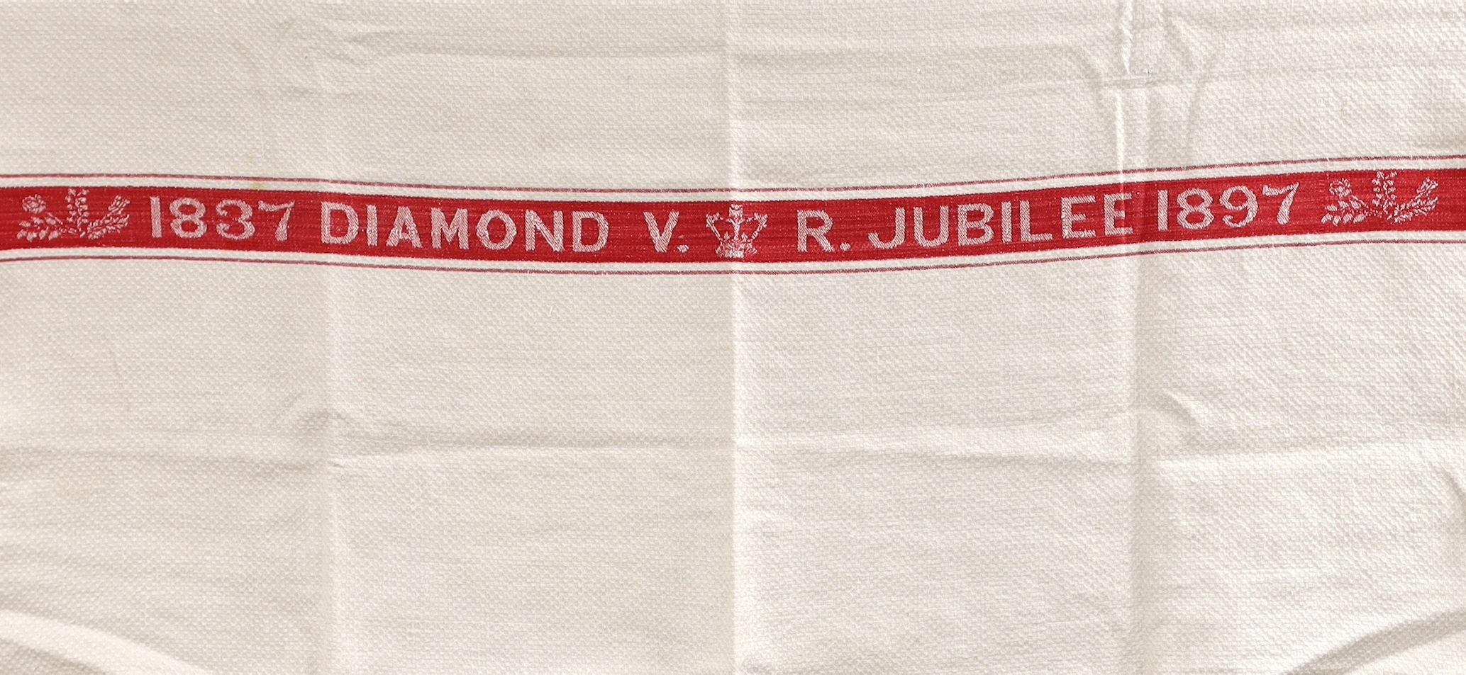 An unusual Victorian jubilee damask hand towel, 1897, and a lace stole, lace trimming and a pair of chamois leather gloves, hand towel 94cm long x 61cm wide